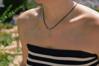 Pendentif Papillon argenté cordon noir
