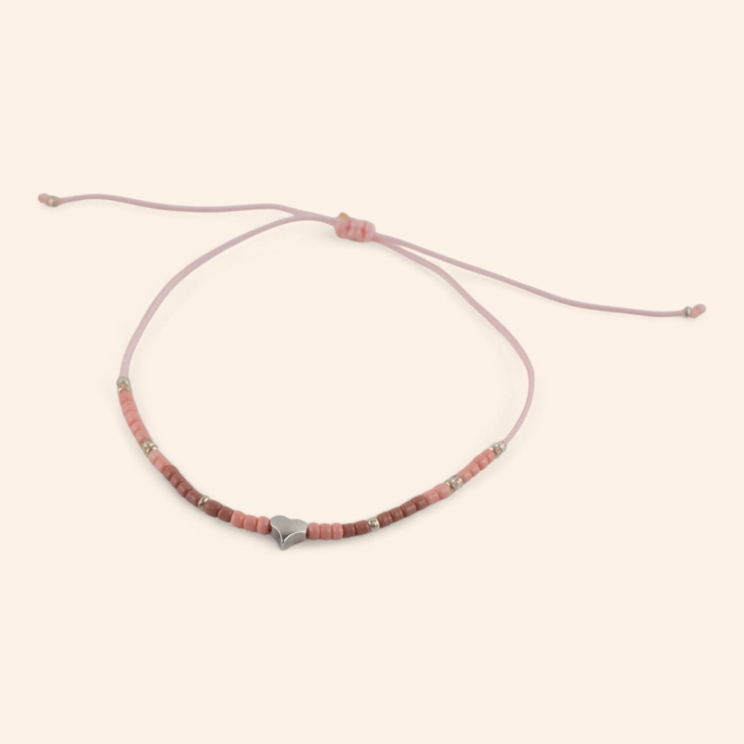 Bracelet en perles rocailles roses et perle cœur en métal argenté  Bracelet Jethyka