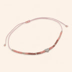 Bracelet en perles rocailles roses et perle cœur en métal argenté  Bracelet Jethyka