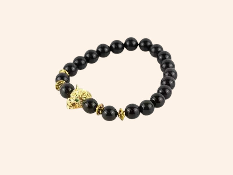 Bracelet en pierres naturelles Obsidienne et perle Loup en métal doré – Bijou puissant et protecteur