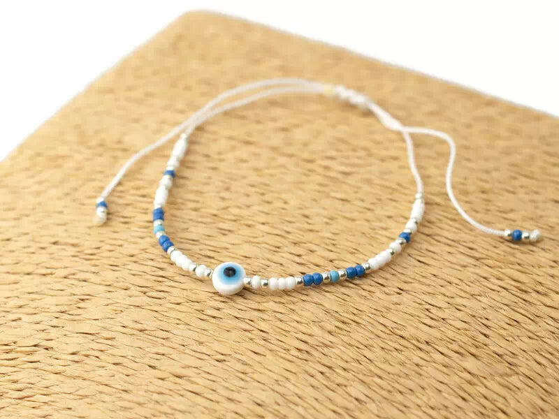 Bracelet Perles Rocailles Bleues et Blanches avec Œil Protecteur – Bijou Talisman Porte-Bonheur  Bracelet Jethyka