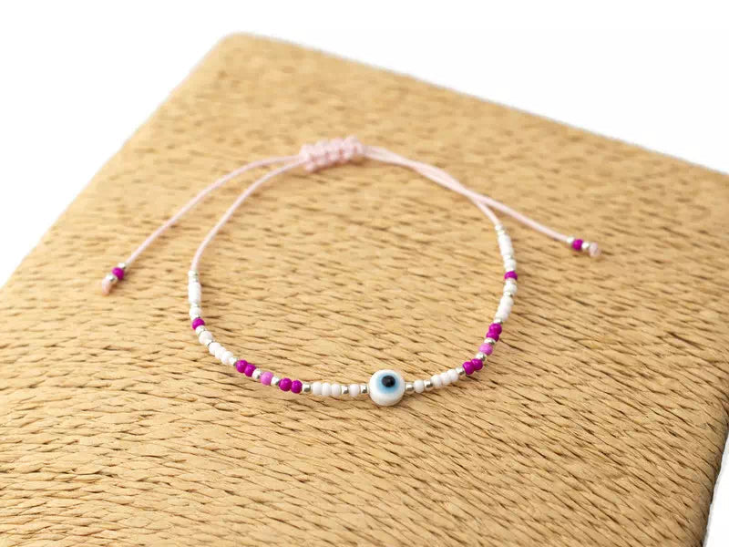 Bracelet Œil protecteur blanc perles rocailles roses et blanches  Bracelet Jethyka