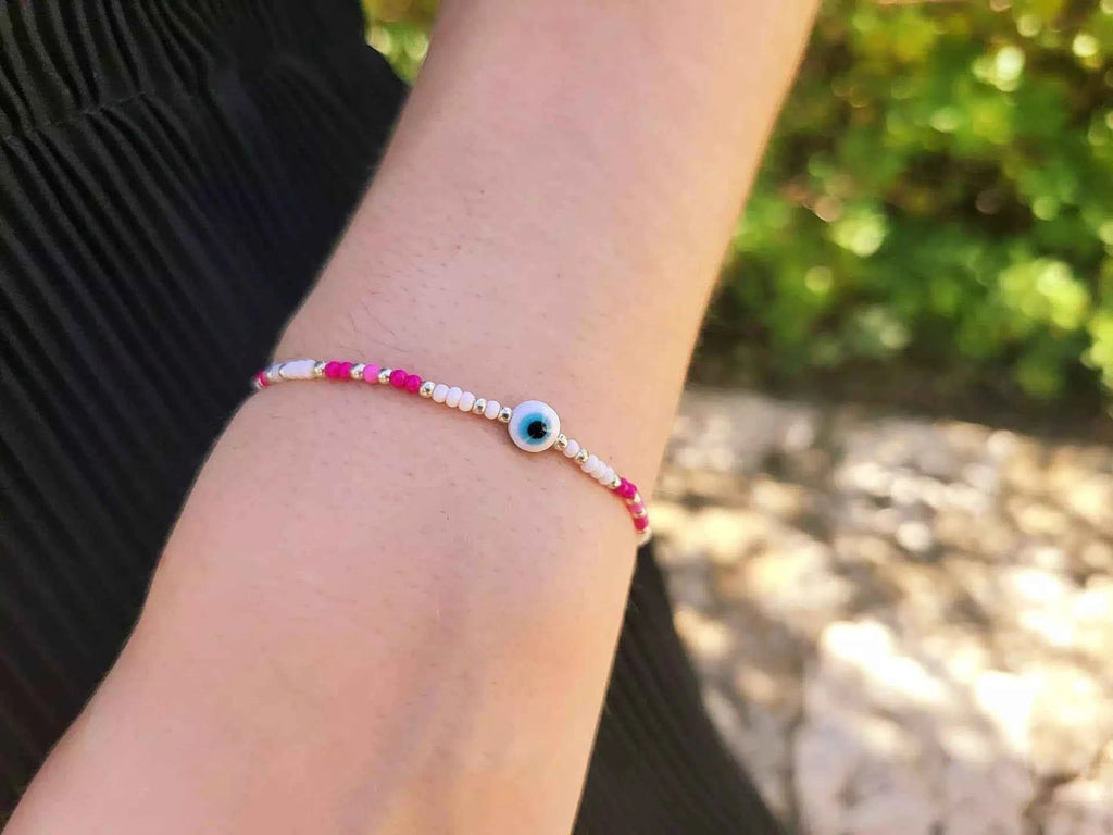 Bracelet Œil protecteur perles rocailles roses et blanches