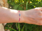 Bracelet Œil protecteur perles rocailles roses et blanches