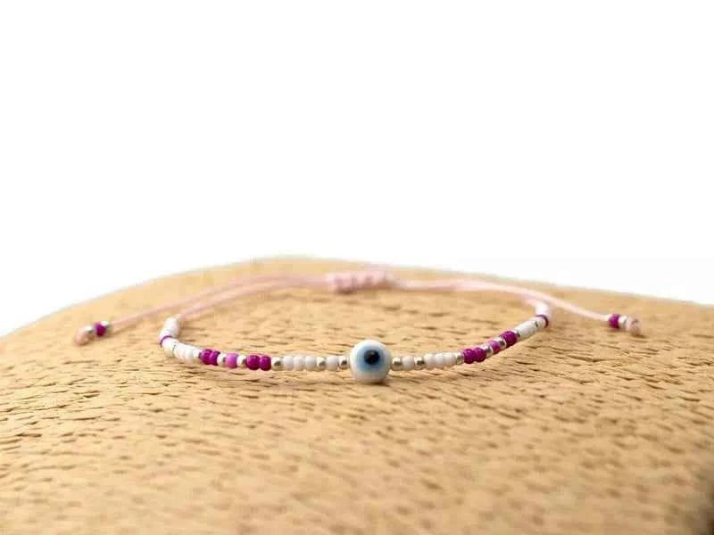 Bracelet Œil protecteur perles rocailles roses et blanches
