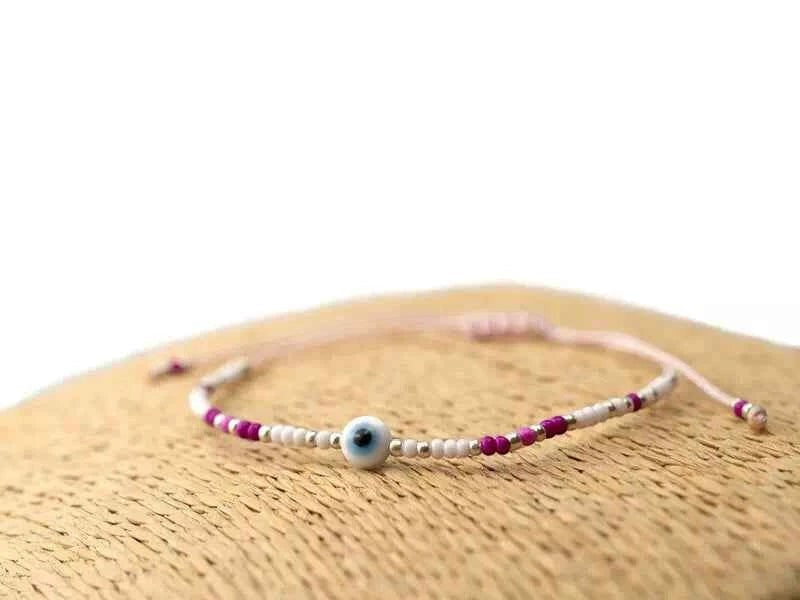 Bracelet Œil protecteur perles rocailles roses et blanches