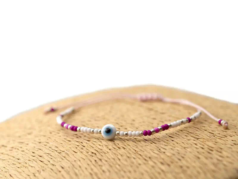 Bracelet Œil protecteur blanc perles rocailles roses et blanches  Bracelet Jethyka
