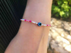Bracelet Œil Protecteur perles rocailles blanches et roses