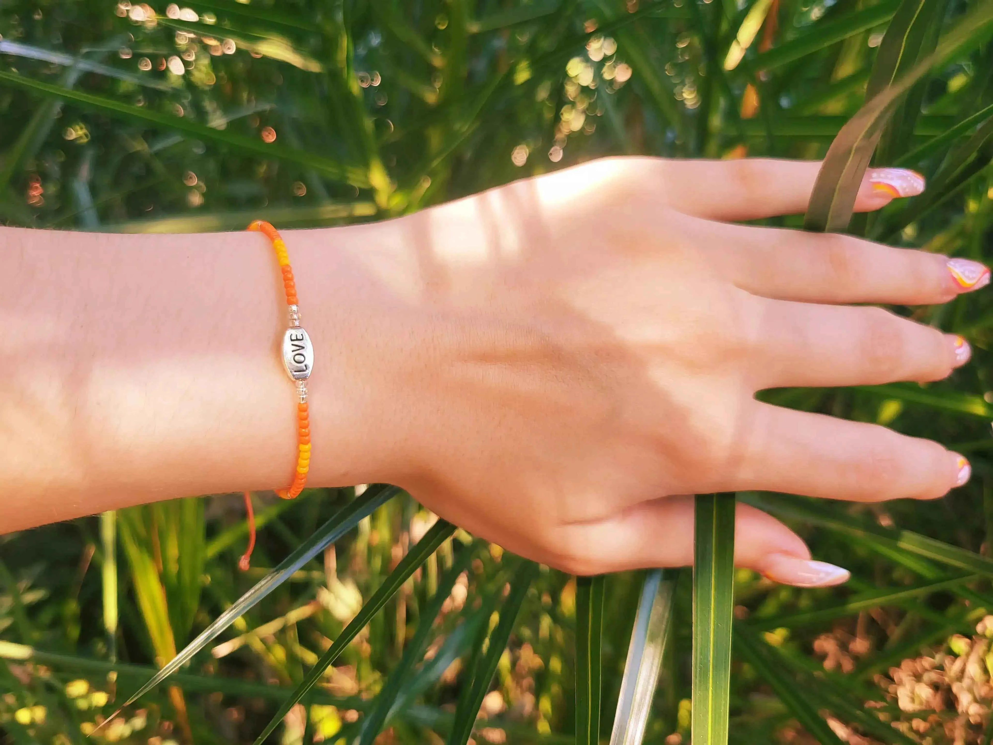 Bracelet Love en perles rocailles Oranges