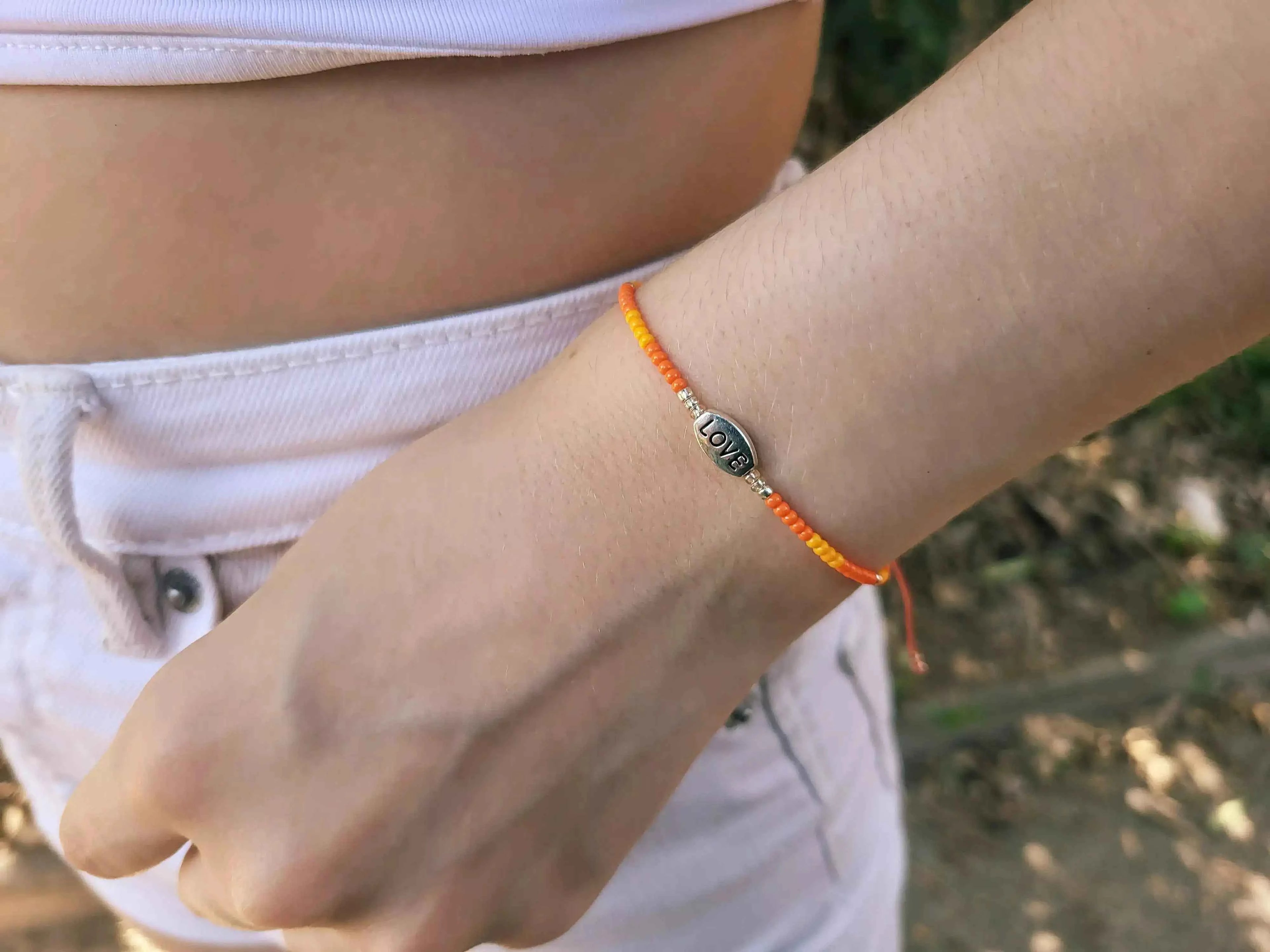 Bracelet Love en perles rocailles Oranges
