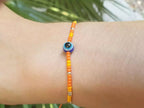 Bracelet Perles Rocailles Oranges et Œil Protecteur  Bracelet Jethyka