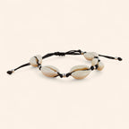 Bracelet noir avec coquillages cauris et perles en métal argenté  Bracelet Jethyka