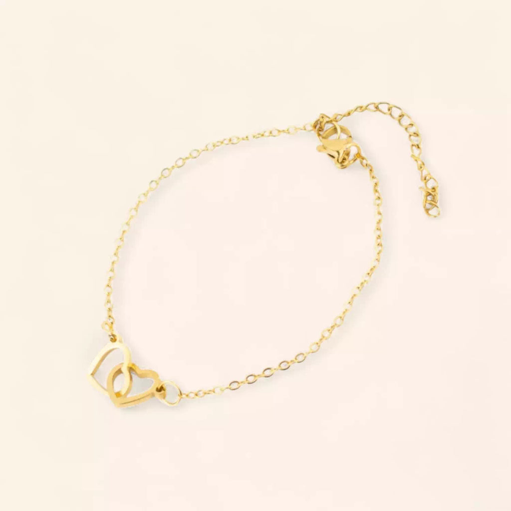 Bracelet femme en métal doré avec 2 cœurs entrelacés – Élégance et amour intemporel  Bracelet Jethyka