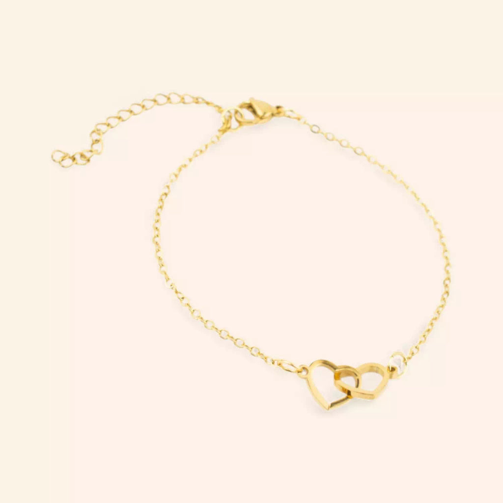 Bracelet femme en métal doré avec 2 cœurs entrelacés – Élégance et amour intemporel  Bracelet Jethyka