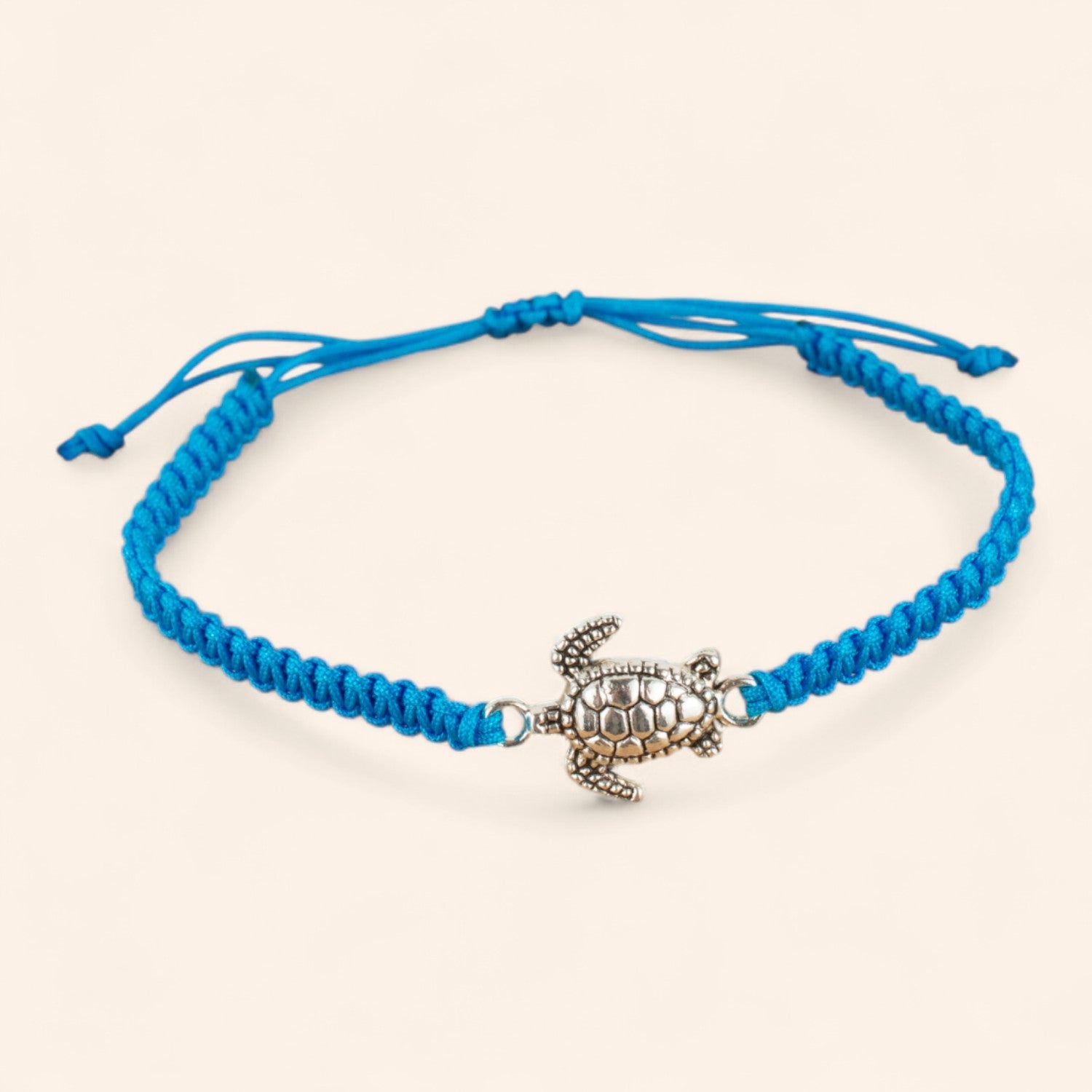 Bracelet Tortue Argentée en Macramé Bleu  Bracelet Jethyka