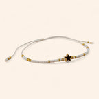 Bracelet en perles rocailles blanches et dorées avec perle étoile en métal doré  Bracelet Jethyka