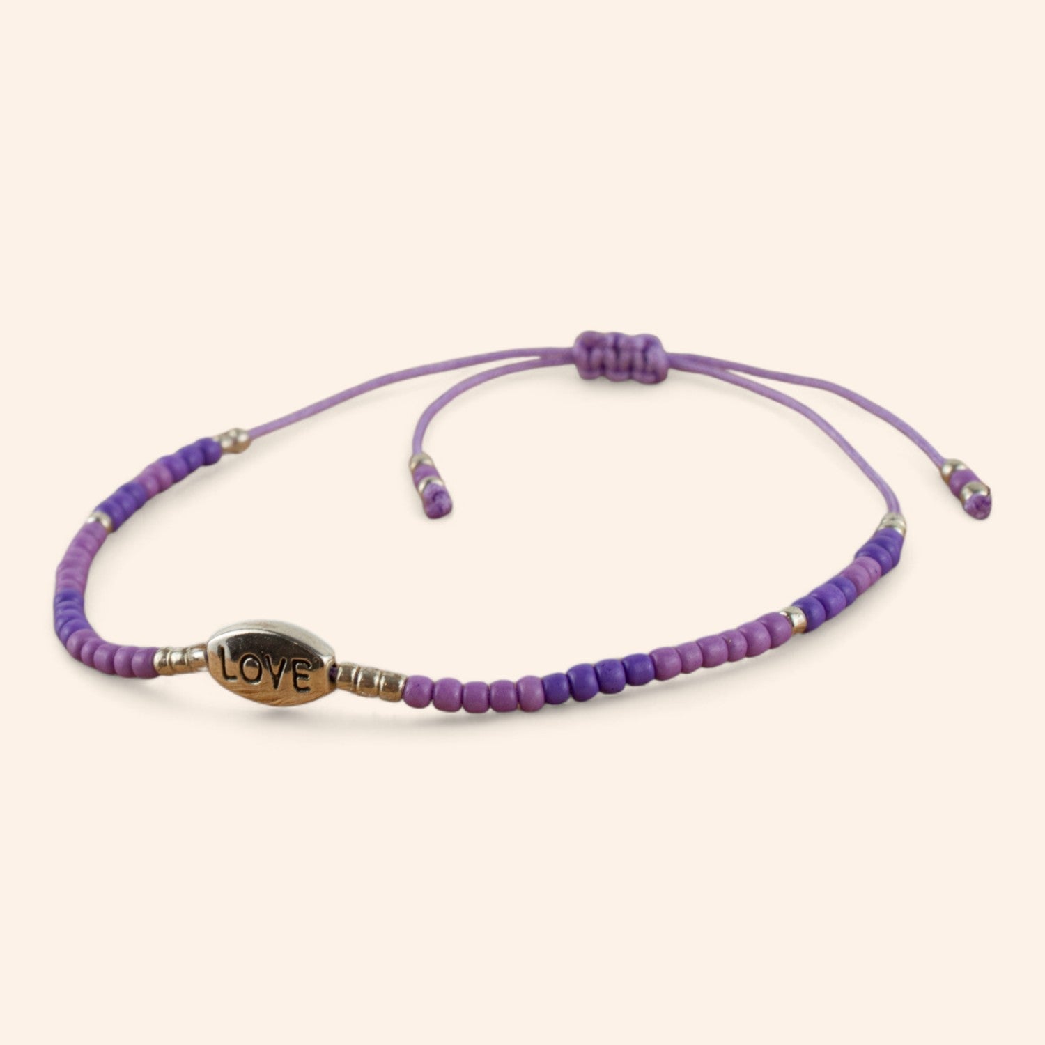Bracelet perles rocailles violettes et perle Love en métal argenté  Bracelet Jethyka