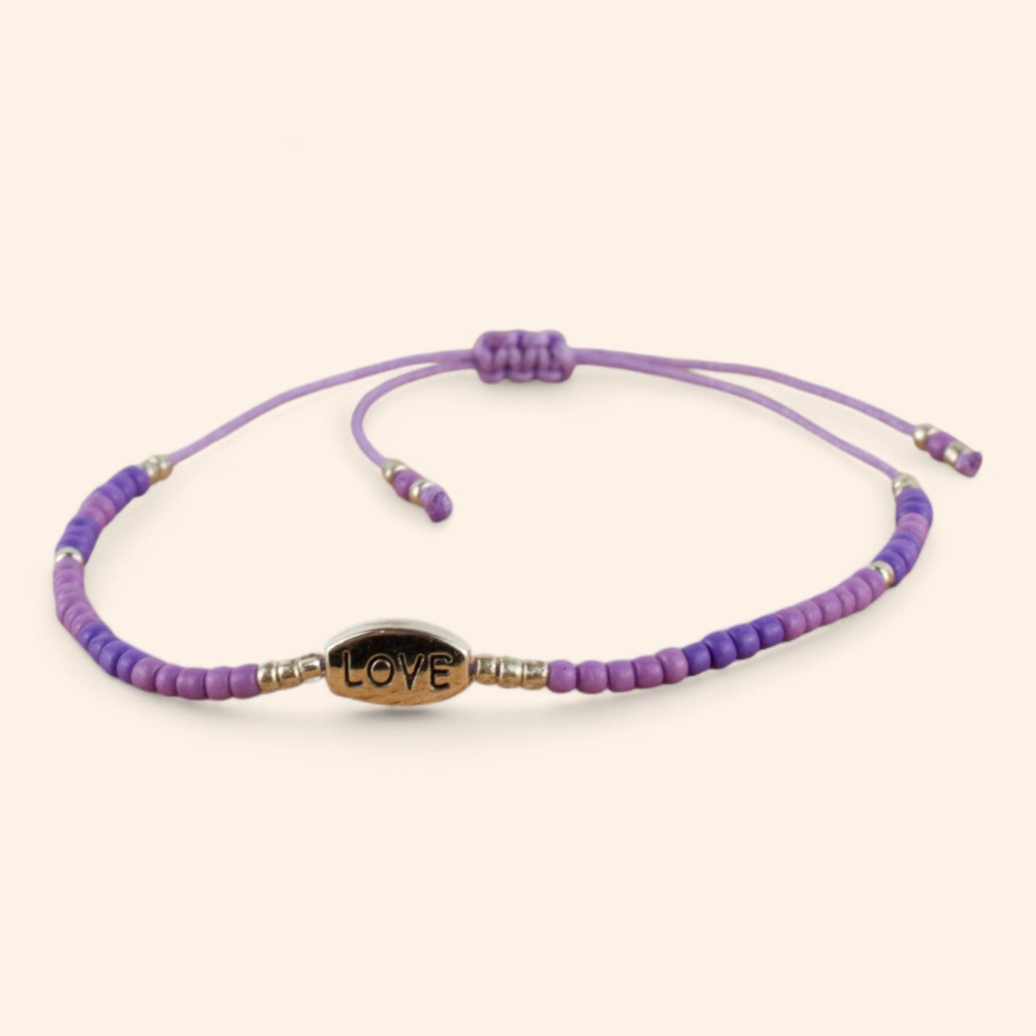 Bracelet perles rocailles violettes et perle Love en métal argenté  Bracelet Jethyka