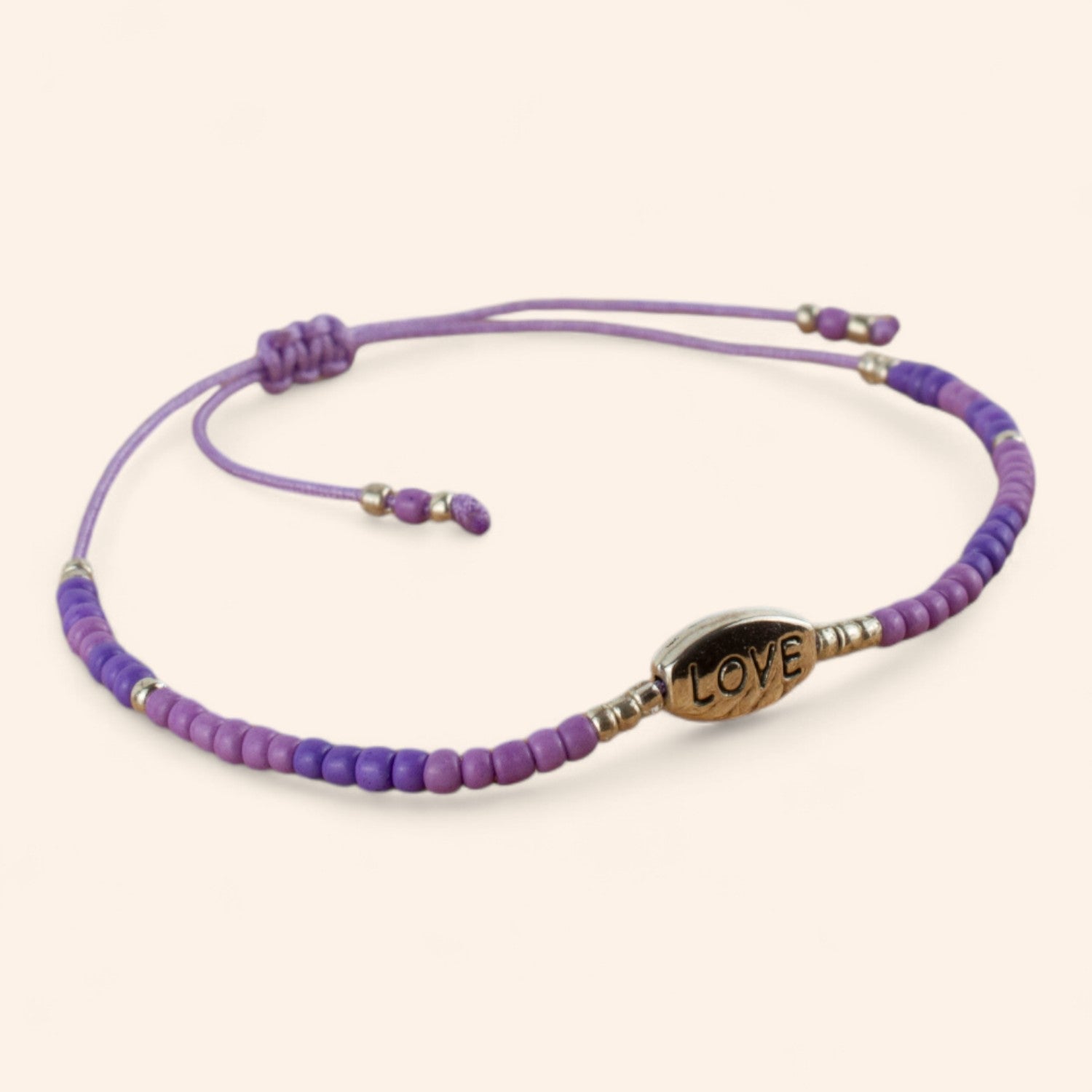 Bracelet perles rocailles violettes et perle Love en métal argenté  Bracelet Jethyka