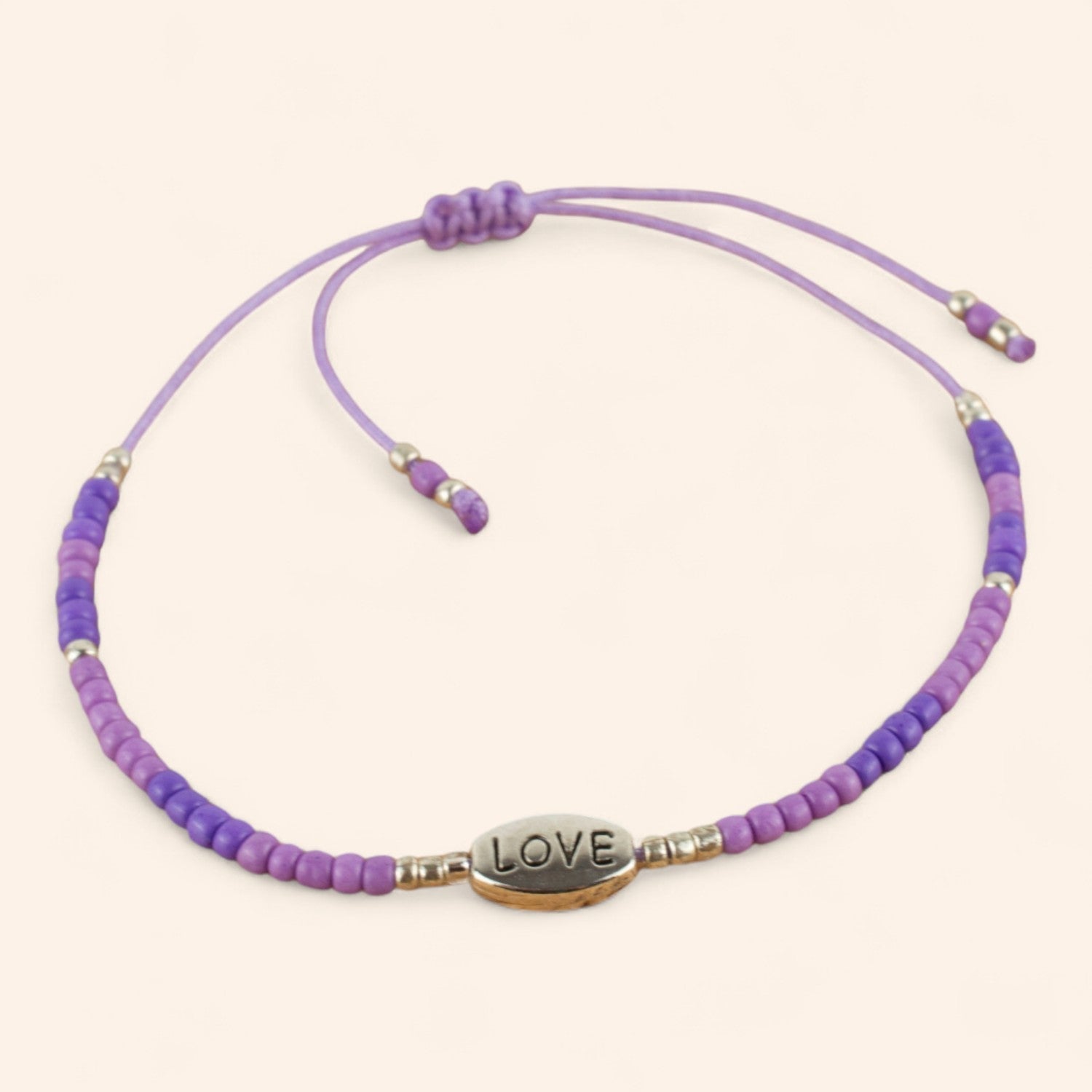 Bracelet perles rocailles violettes et perle Love en métal argenté  Bracelet Jethyka