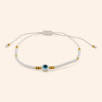 Bracelet Perles Rocailles Blanches et Dorées avec Œil Protecteur  Bracelet Jethyka