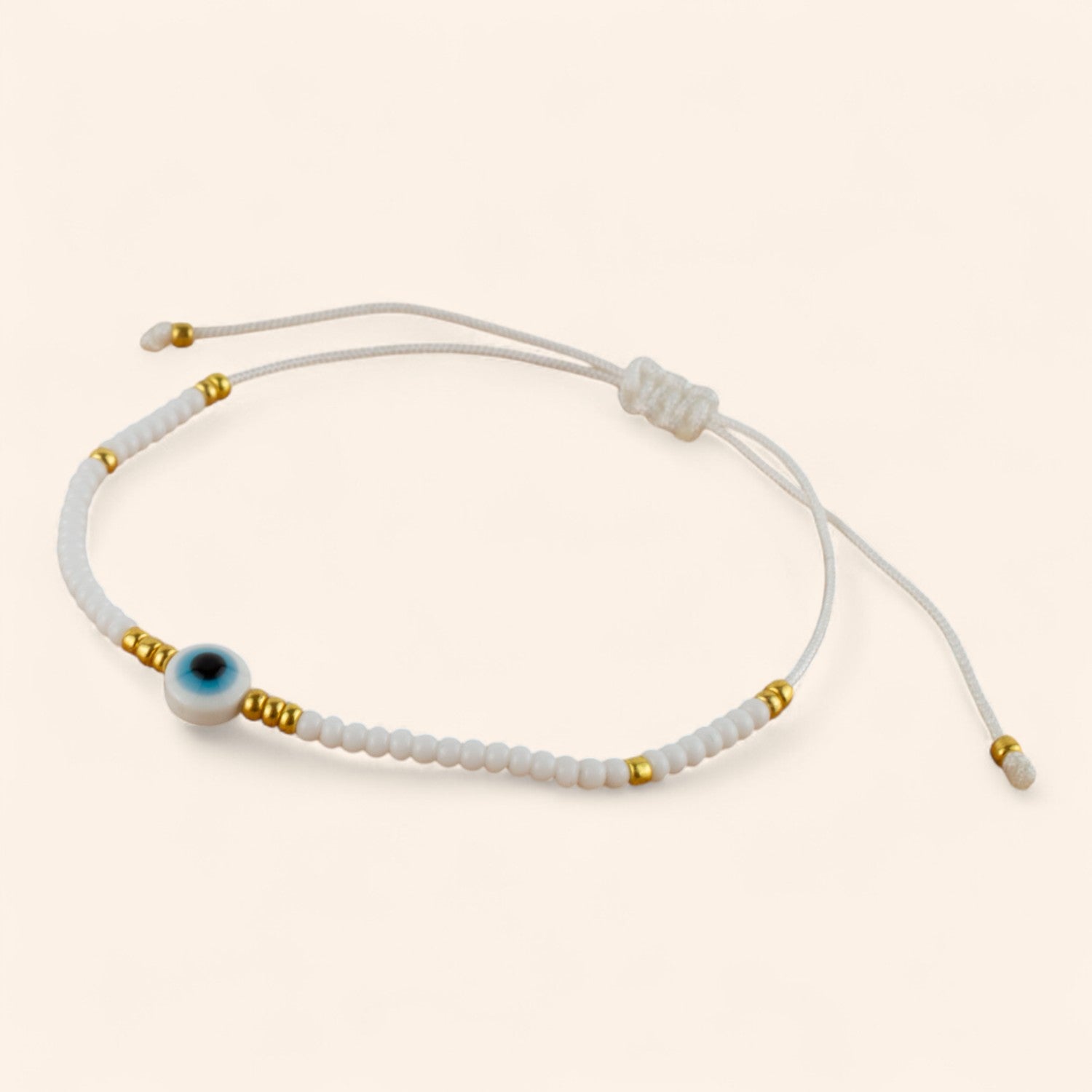 Bracelet Perles Rocailles Blanches et Dorées avec Œil Protecteur  Bracelet Jethyka