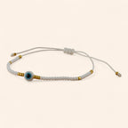 Bracelet Perles Rocailles Blanches et Dorées avec Œil Protecteur  Bracelet Jethyka