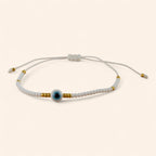 Bracelet Perles Rocailles Blanches et Dorées avec Œil Protecteur  Bracelet Jethyka