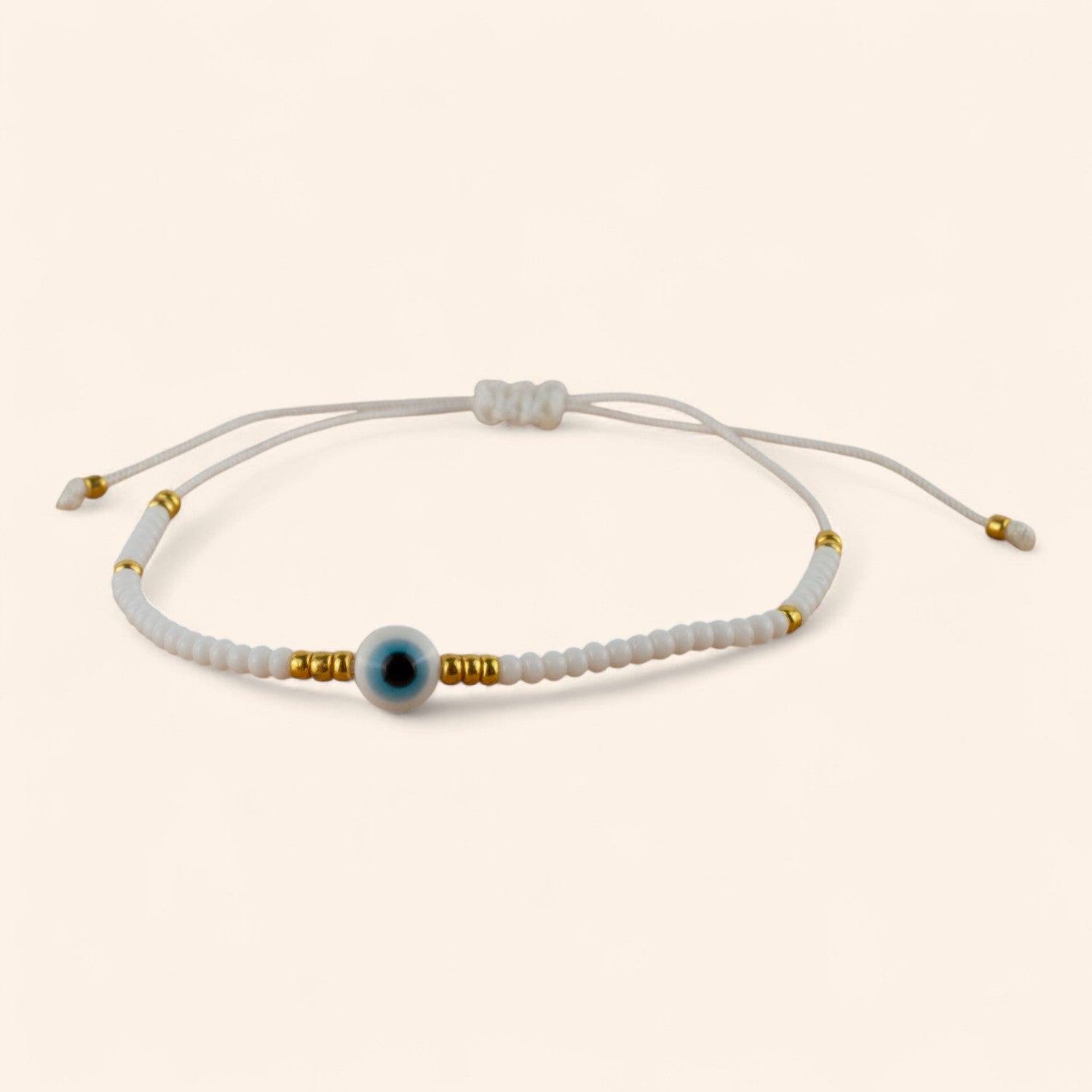 Bracelet Perles Rocailles Blanches et Dorées avec Œil Protecteur  Bracelet Jethyka