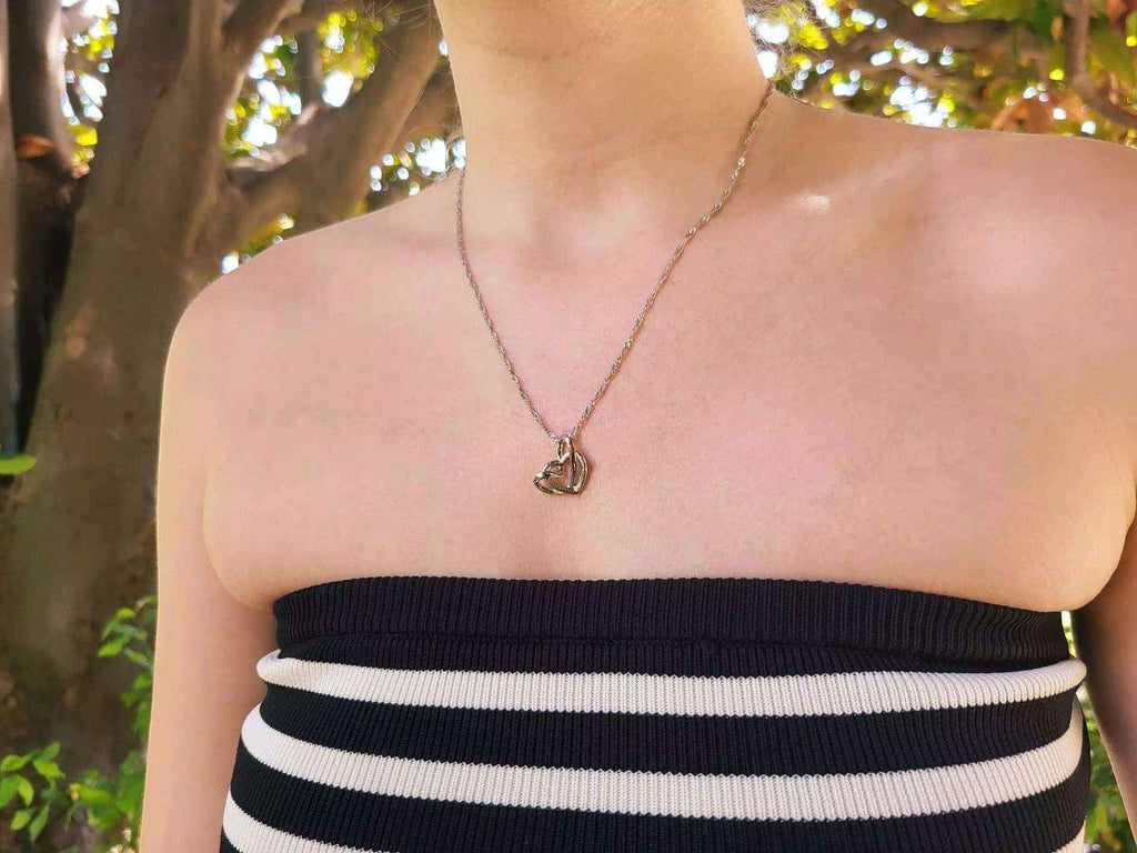 Pendentif Cœurs entrelacés chaîne argentée