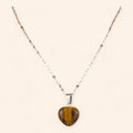 Pendentif cœur en pierres naturelles œil de tigre et chaîne argentée  Pendentif Jethyka