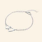 Bracelet Cœurs entrelacés et chaîne argentée