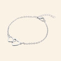 Bracelet Cœurs entrelacés et chaîne argentée