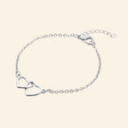 Bracelet Cœurs entrelacés et chaîne argentée