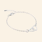 Bracelet Cœurs entrelacés et chaîne argentée