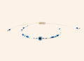 Bracelet JETHYKA œil protecteur en perles de rocaille bleues et blanches, cordon réglable