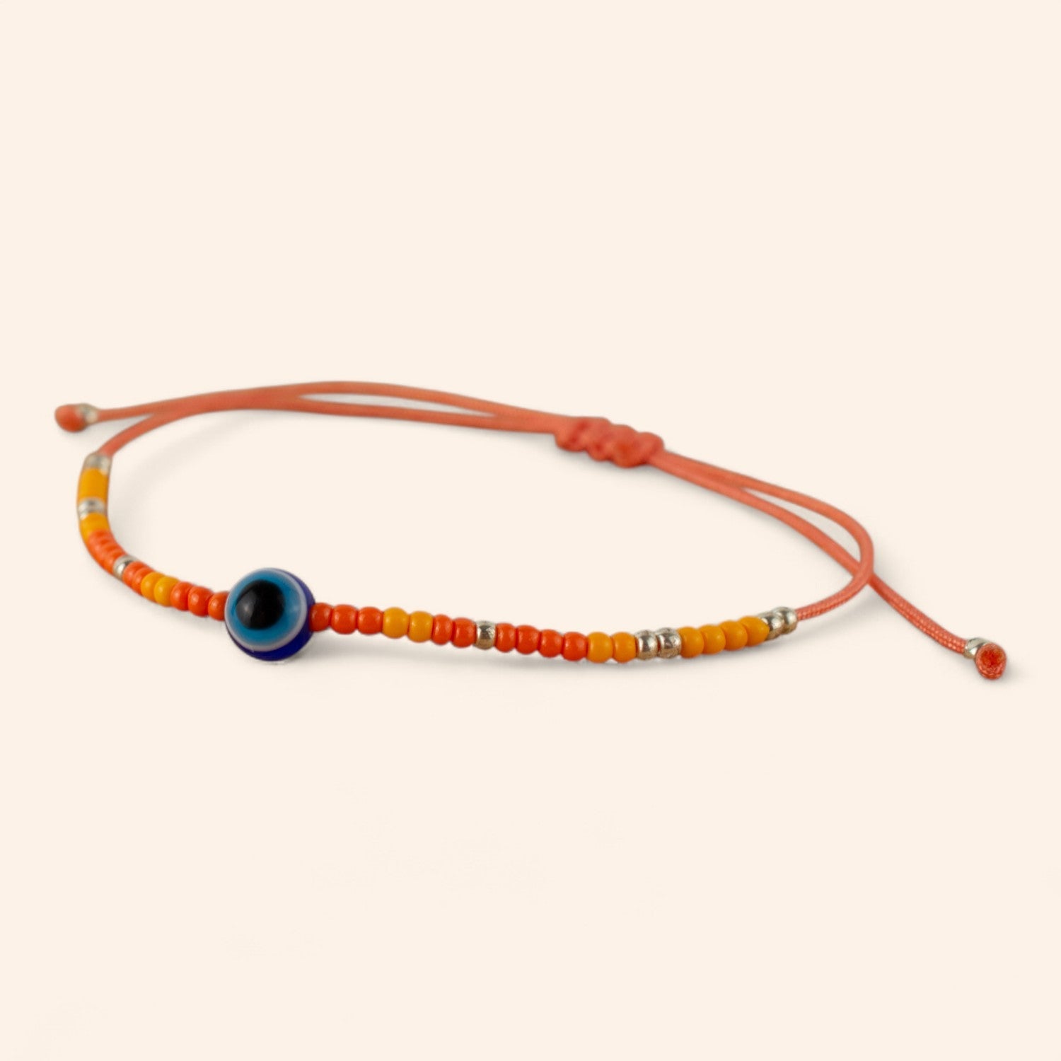 Bracelet Perles Rocailles Oranges et Œil Protecteur  Bracelet Jethyka