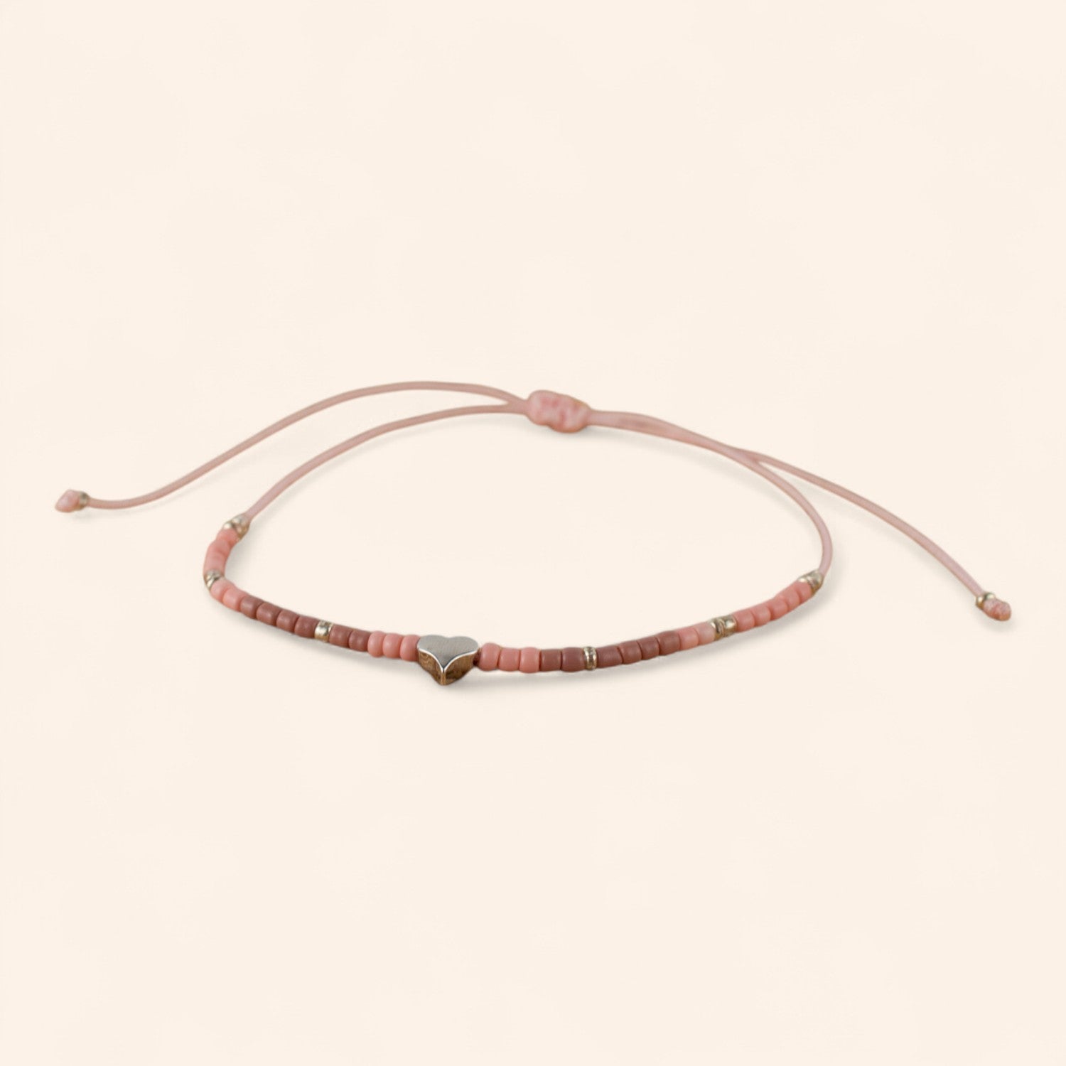 Bracelet en perles rocailles roses et perle cœur en métal argenté  Bracelet Jethyka